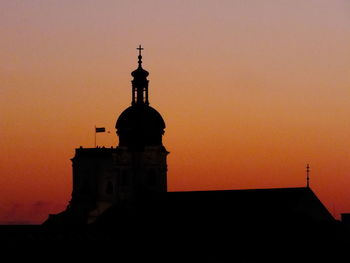 Low angle view of built structure at sunset