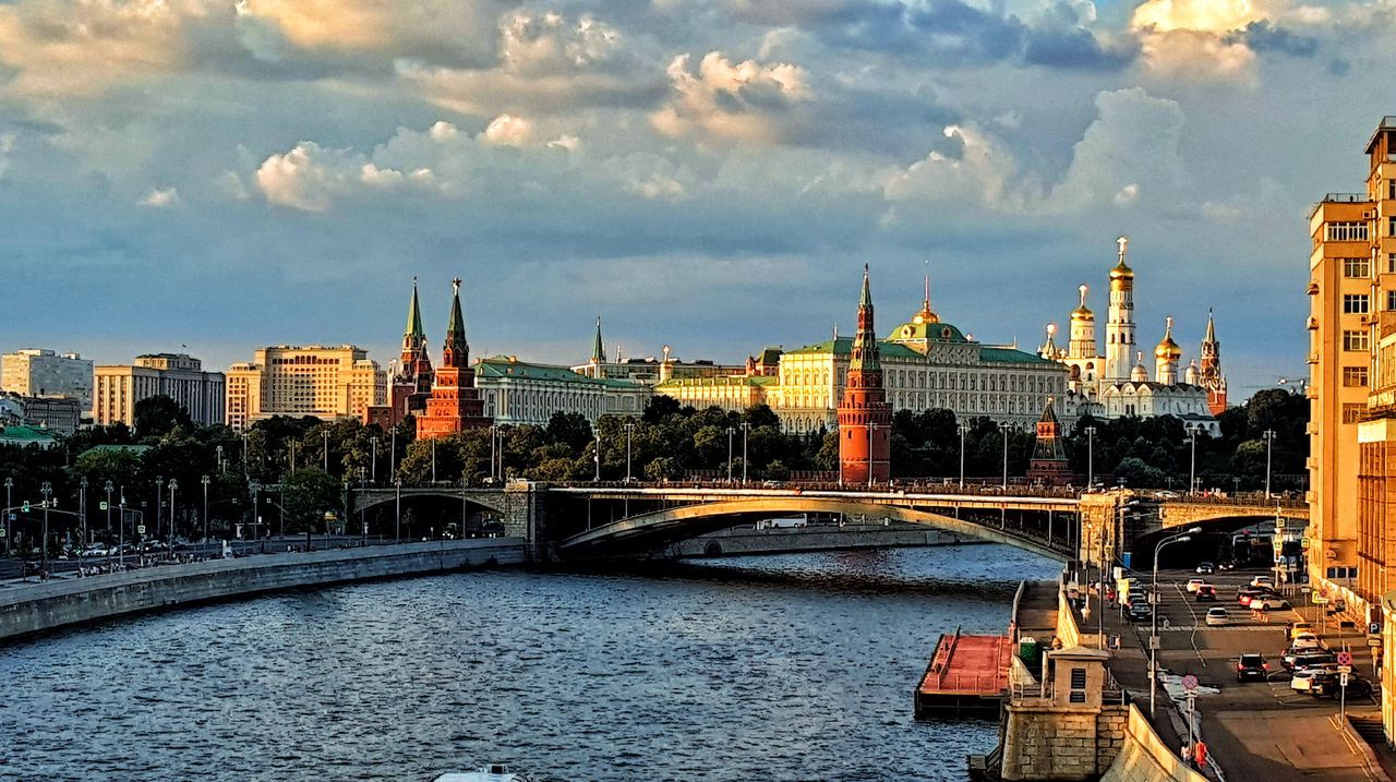 built structure, architecture, building exterior, cloud - sky, sky, bridge, connection, water, river, bridge - man made structure, city, transportation, building, nature, cityscape, waterfront, travel destinations, tower, no people, outdoors, office building exterior, skyscraper, spire