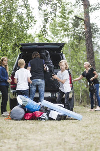 Rear view of people enjoying at park