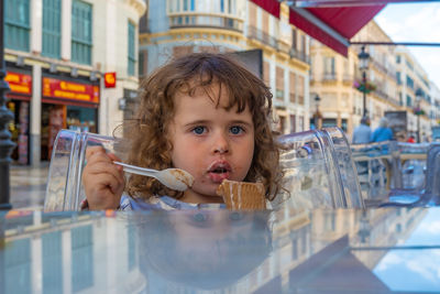 Portrait of cute girl holding ice cream