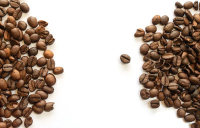 Close-up of coffee beans against white background