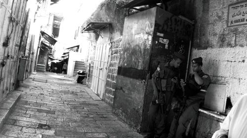 Narrow street along buildings