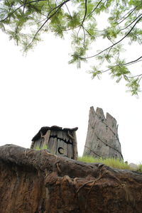 Low angle view of rock formation against sky