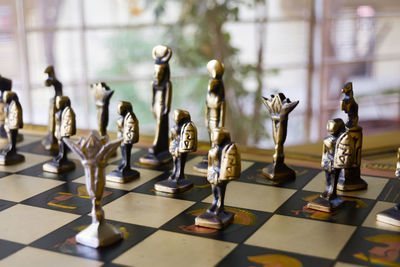 Close-up of chess pieces on table
