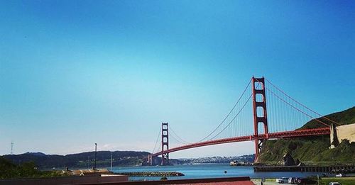 Suspension bridge against blue sky