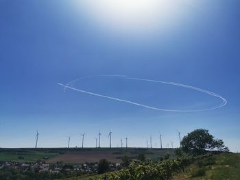 Low angle view of vapor trail against blue sky