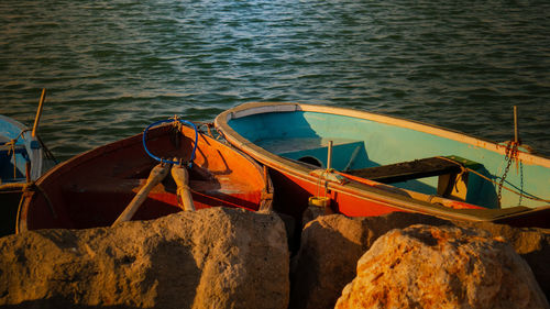 Boats moored on sea shore