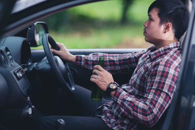 Man sitting in car
