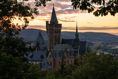 Exterior of building against sky during sunset