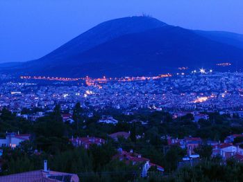 High angle view of illuminated buildings in city at night