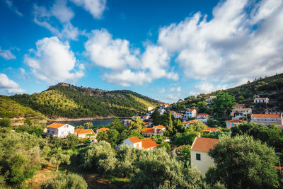 Houses in town against sky