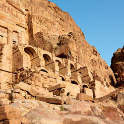 Low angle view of rock formation against sky