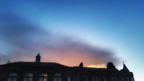 Silhouette built structure against sky