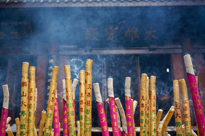 Incense sticks burning outside temple