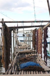 Clothes drying on railing against sky