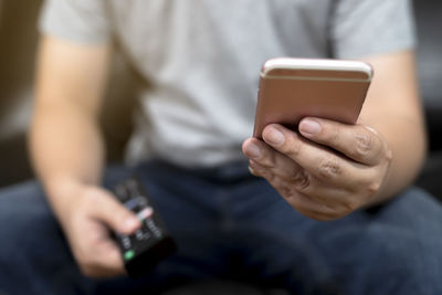Close-up of man using mobile phone
