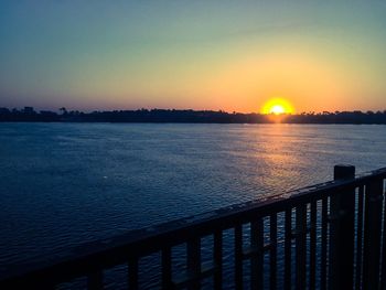 Scenic view of sunset over river