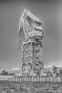 Low angle view of tower against cloudy sky