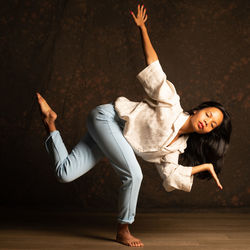 Woman lying on hardwood floor