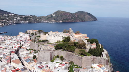 High angle view of town by sea