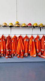 Firefighters clothes hanging on wall