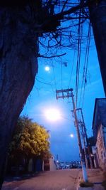 Low angle view of electricity pylon against sky