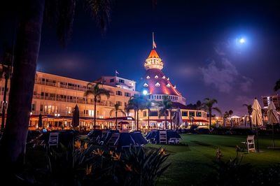 Illuminated temple against sky at night