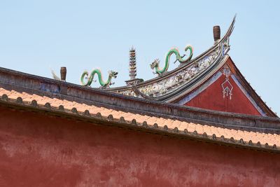 Low angle view of traditional building against clear sky