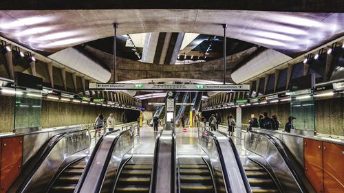 People by escalators in subway station