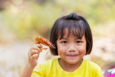 Portrait of boy holding ice cream