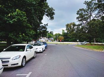 Cars on road against sky