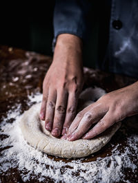 Midsection of person preparing food on table