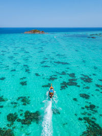 Scenic view of sea against blue sky