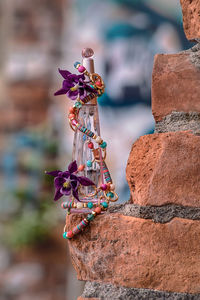 Close-up of decoration on brick wall