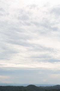 Scenic view of landscape against cloudy sky