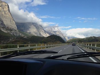 Road seen through car windshield