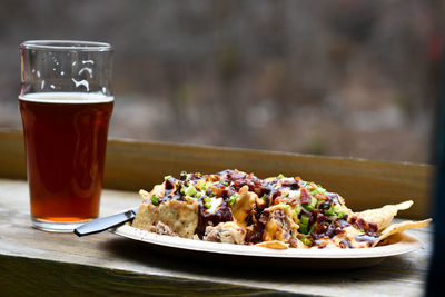 Close-up of food and beer on table