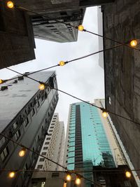 Low angle view of illuminated buildings at dusk