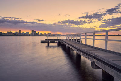 View of bridge over sea against cloudy sky