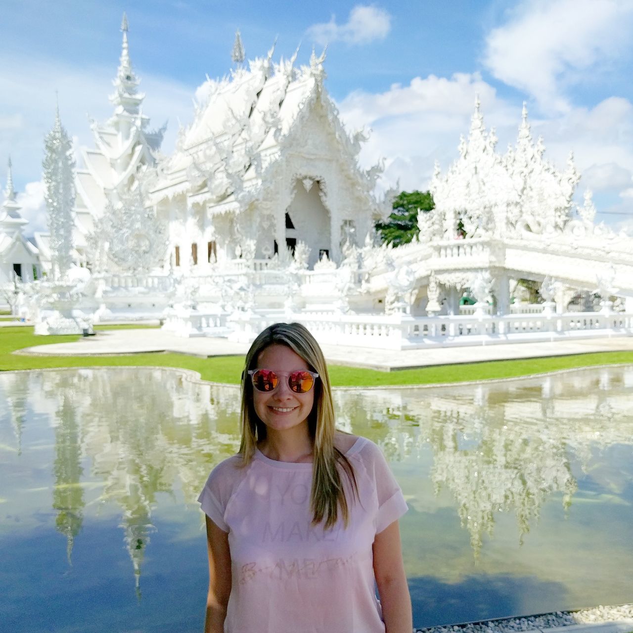 one woman only, only women, looking at camera, portrait, front view, adults only, one person, water, adult, standing, travel destinations, women, people, smiling, happiness, real people, outdoors, day, young adult