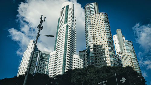 Low angle view of modern buildings against sky