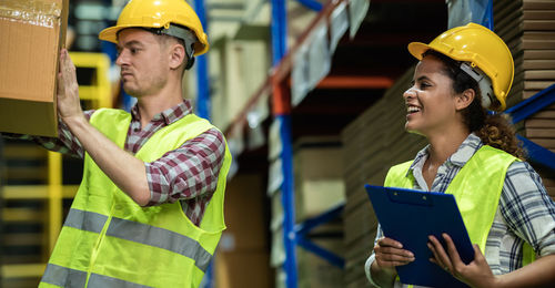 Man working with arms raised