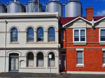 Low angle view of building against blue sky