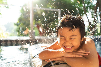 Smiling boy in swimming pool