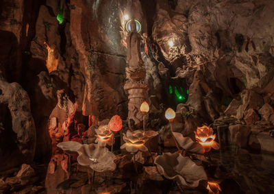 Illuminated lighting equipment hanging in cave