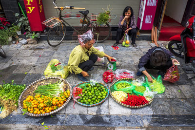 People in basket for sale at market