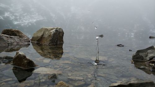 Reflection of rocks in sea