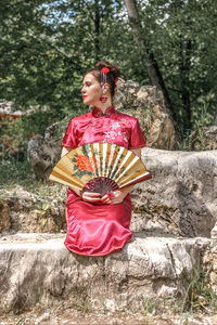 Portrait of young woman with umbrella