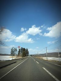 Empty road along landscape
