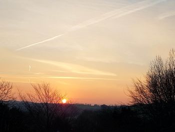 Silhouette landscape against sky during sunset